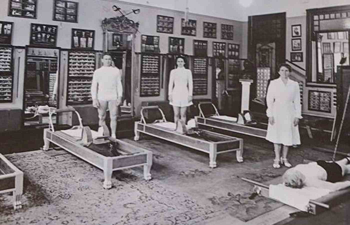 A photograph of Joseph Pilates displayed inside a Power of Pilates studio