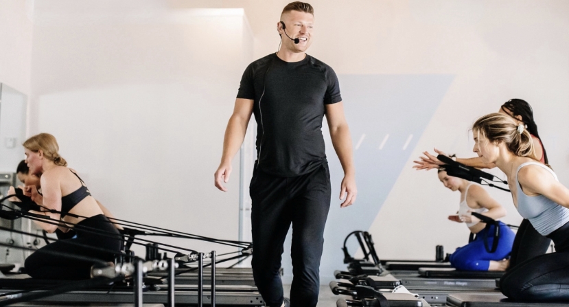 Nathan Ross Rees teaching a Reformer Pilates workshop
