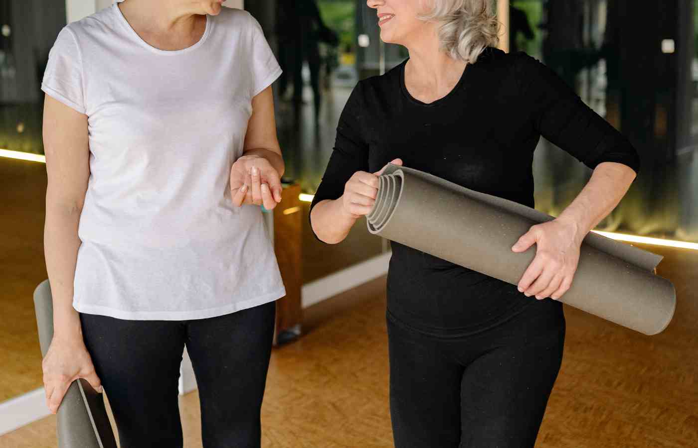 Women taking part in a supportive Pilates class